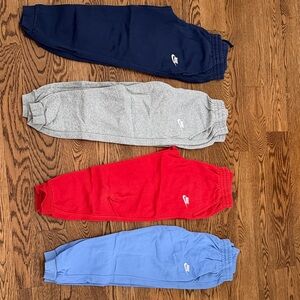 Nike Kids' Sweatpants set of 4 - Navy, Gray, Red, and Blue Yth Large